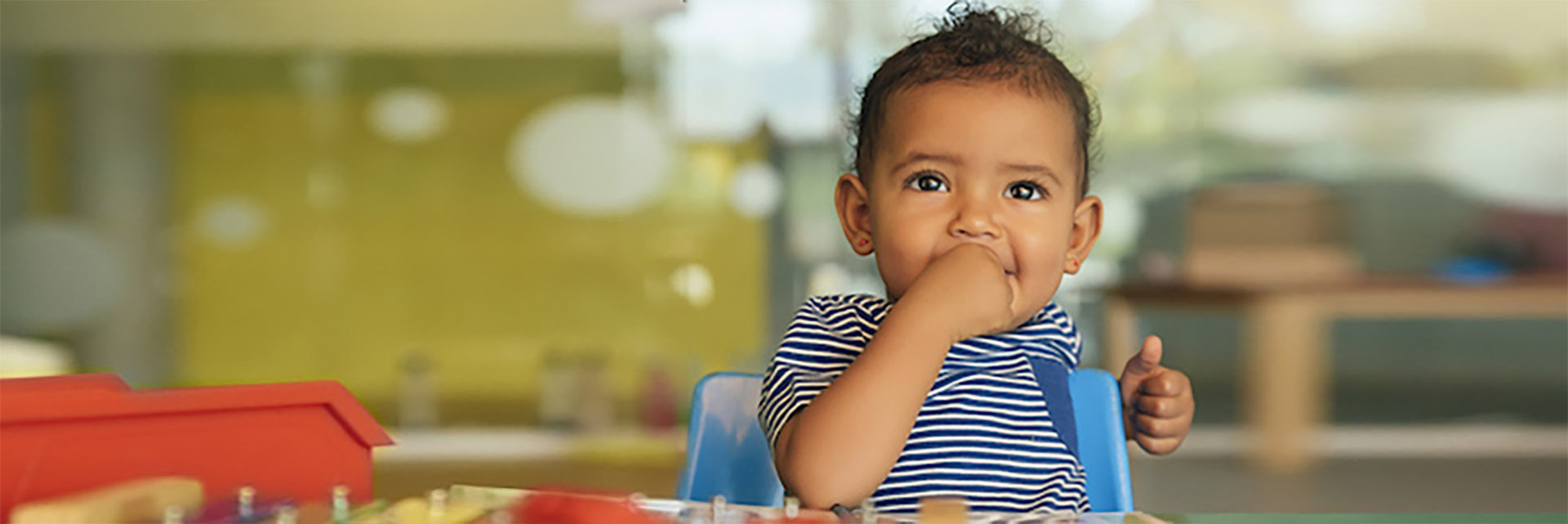 Baby playing at table