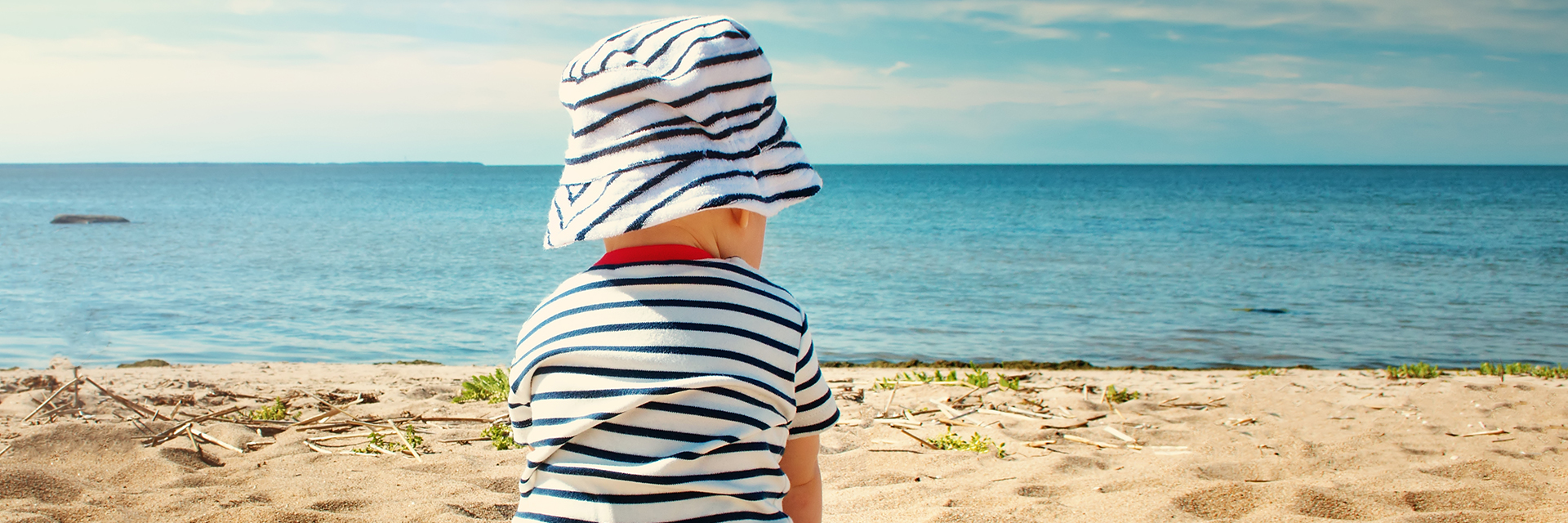 Baby sitting at the beach