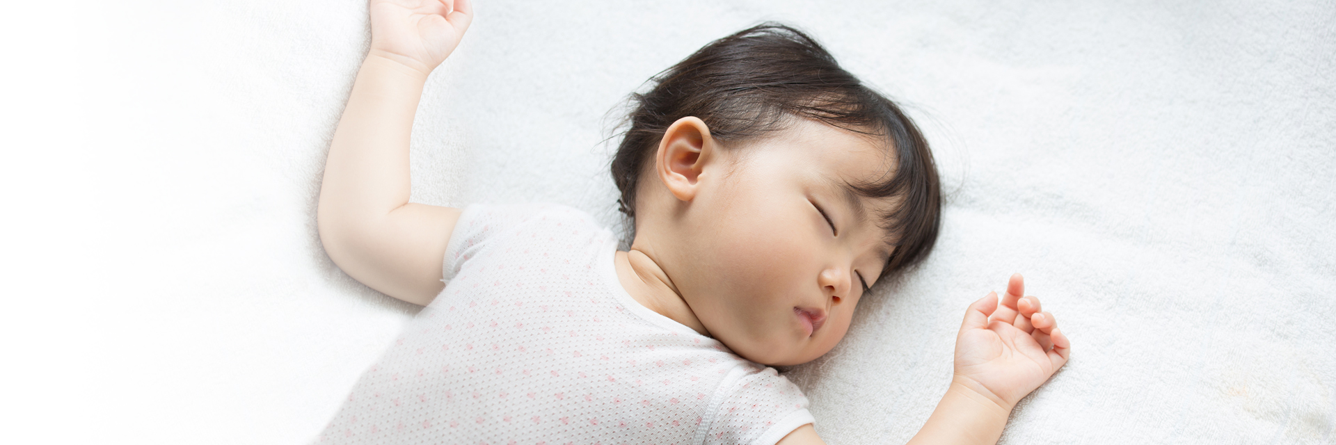 Baby sleeping in bed