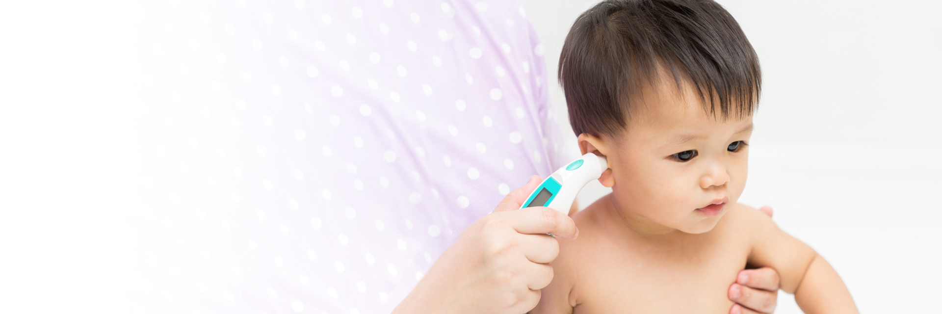Little boy getting ear checked