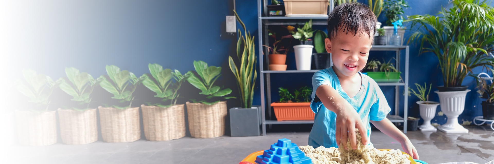 Little boy playing in sand