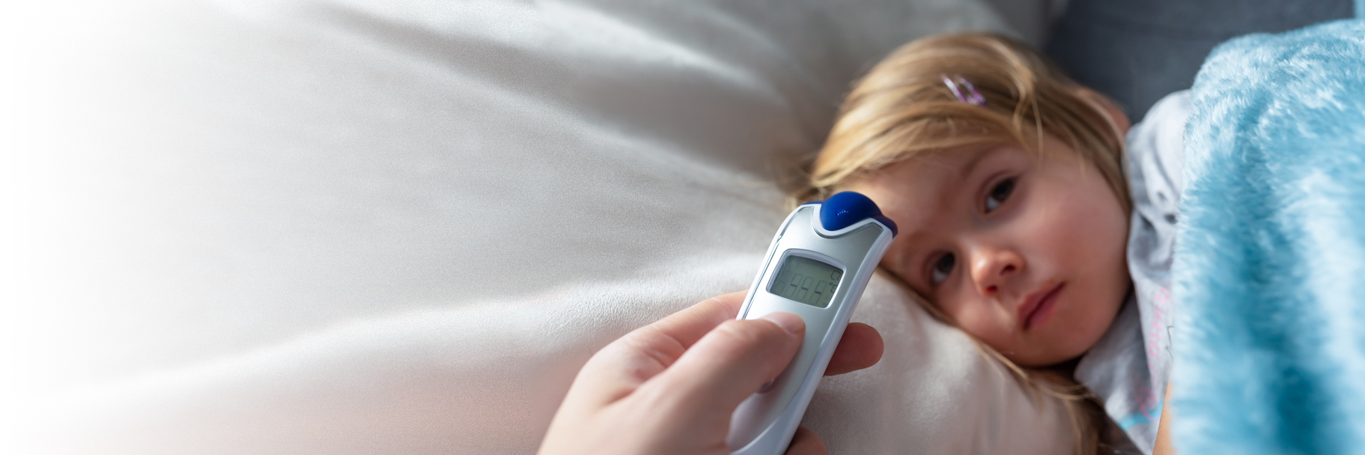 Little girl sick in bed