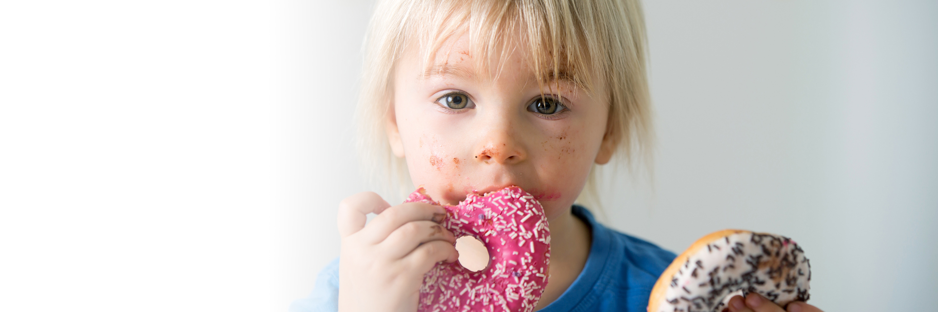 Child eating donuts
