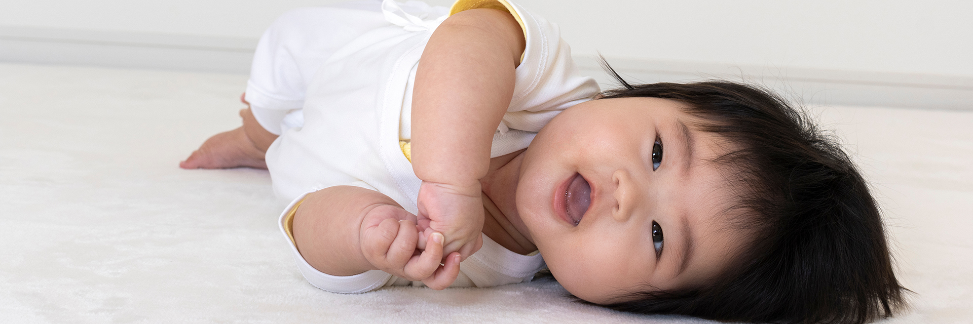 Baby laying on the floor