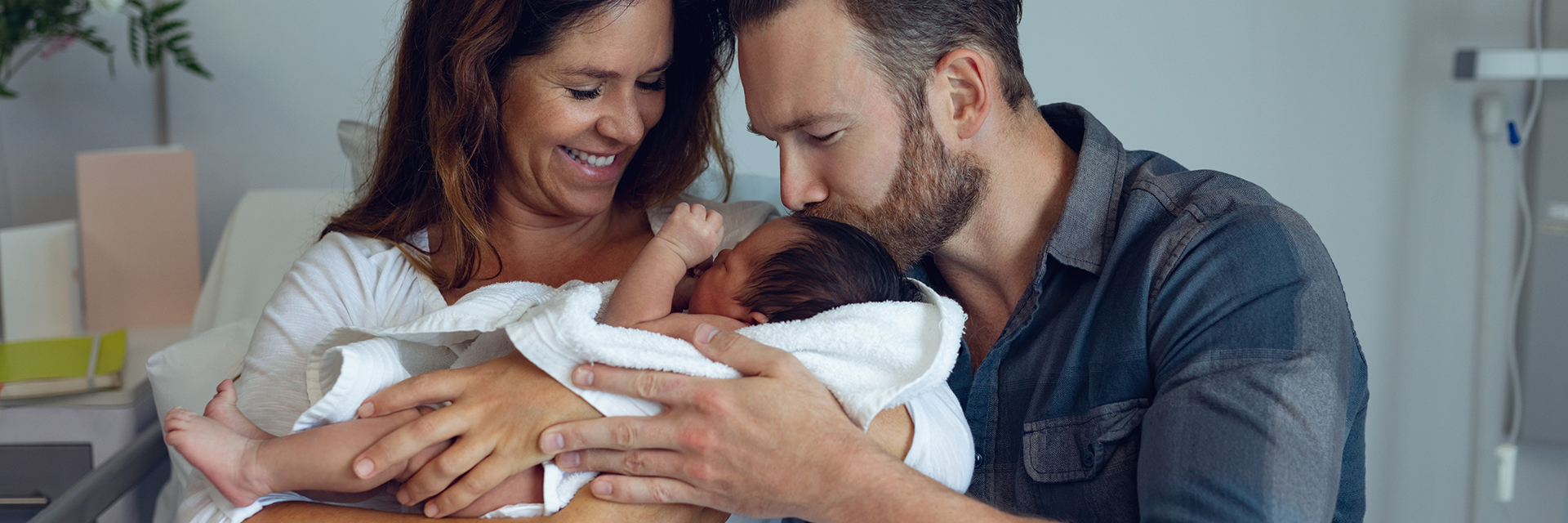 Mom and dad bonding with baby