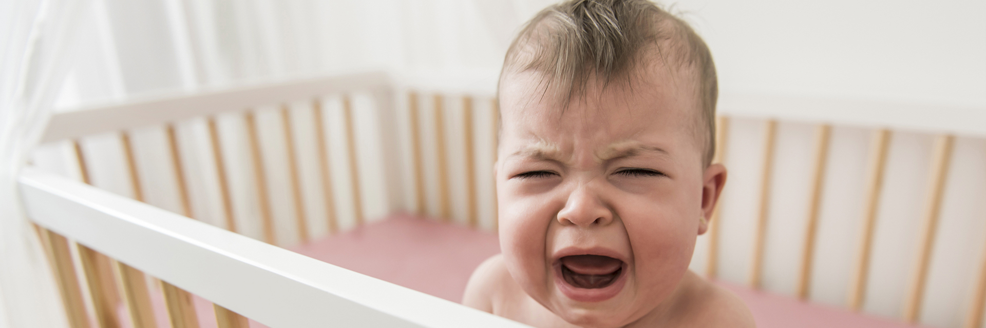 Baby crying in crib