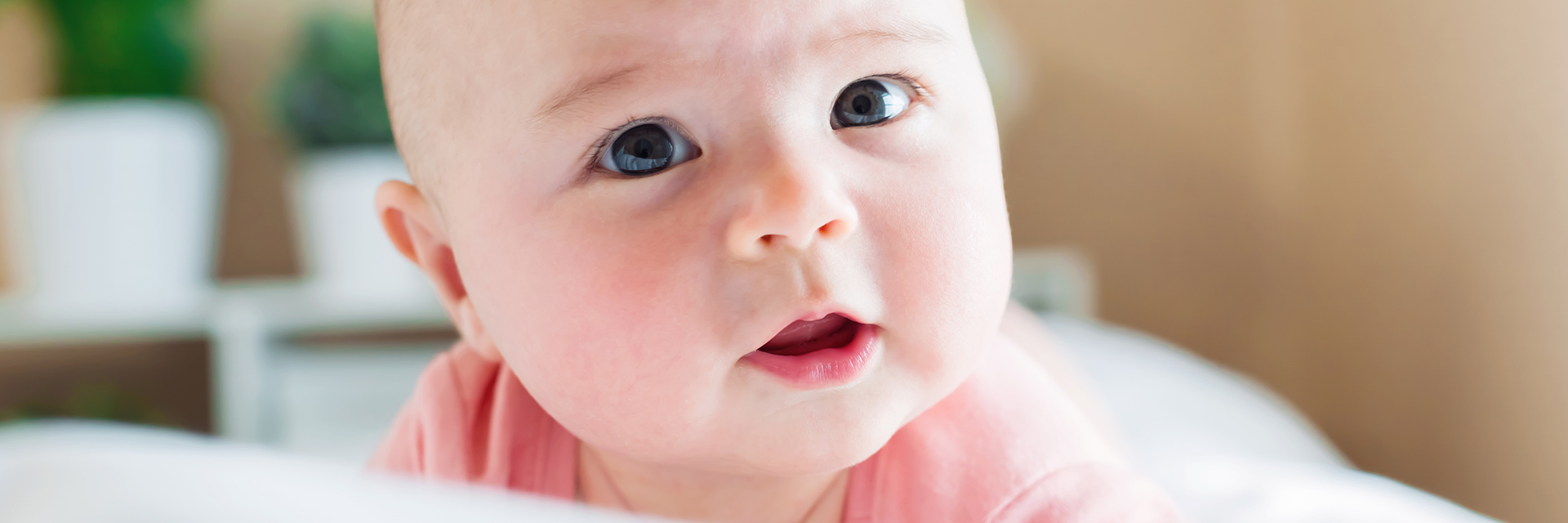 Baby girl in pink oensie