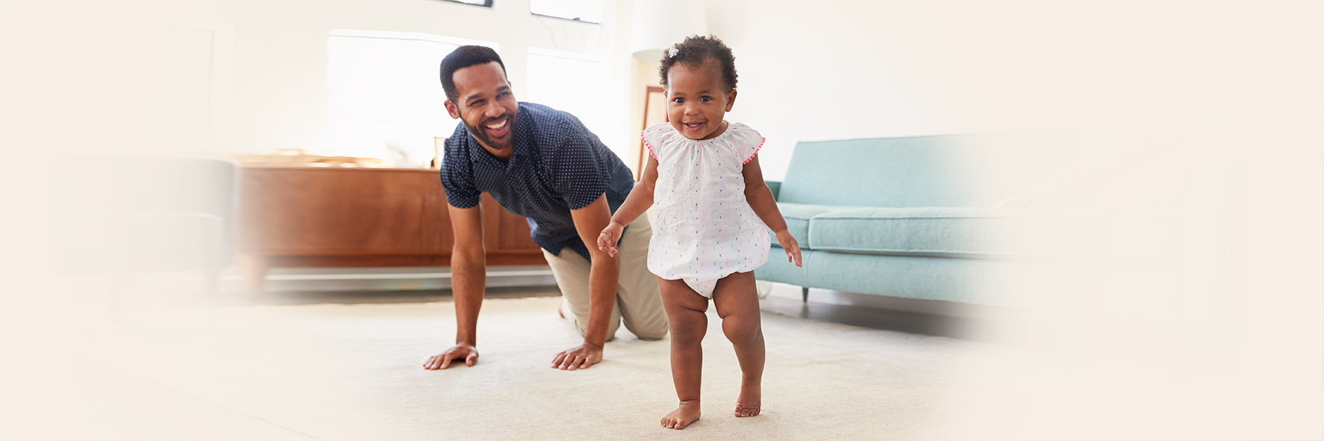 Dad and baby girl playing