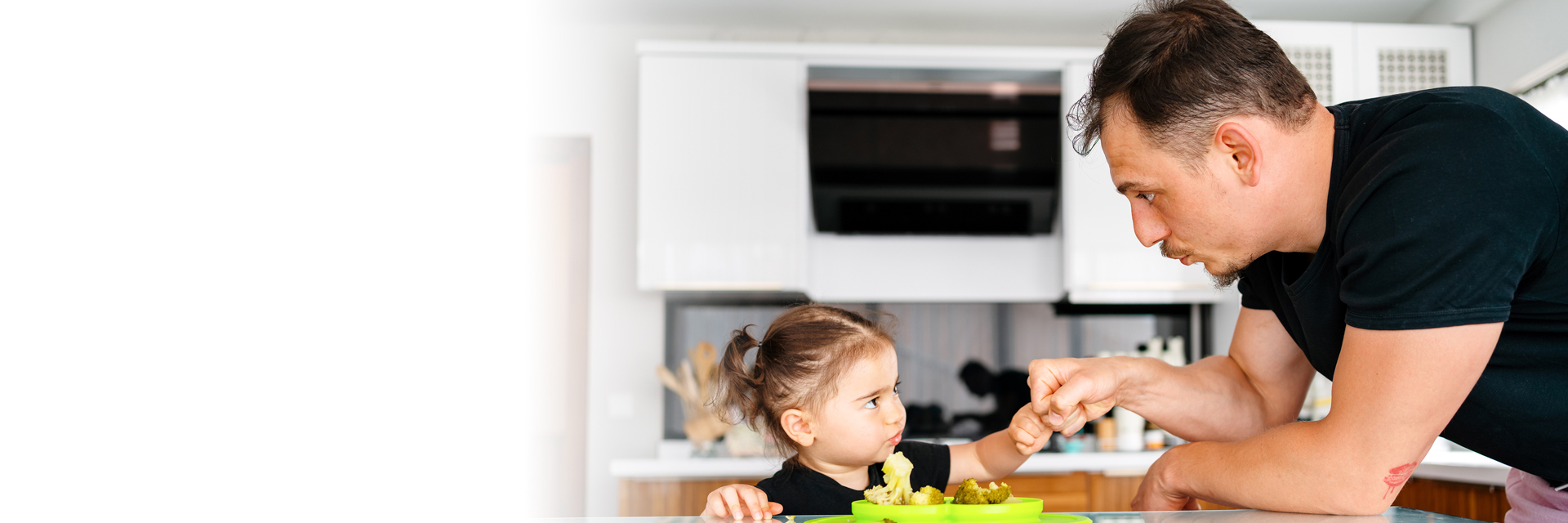 Dad and daughter fist bumping