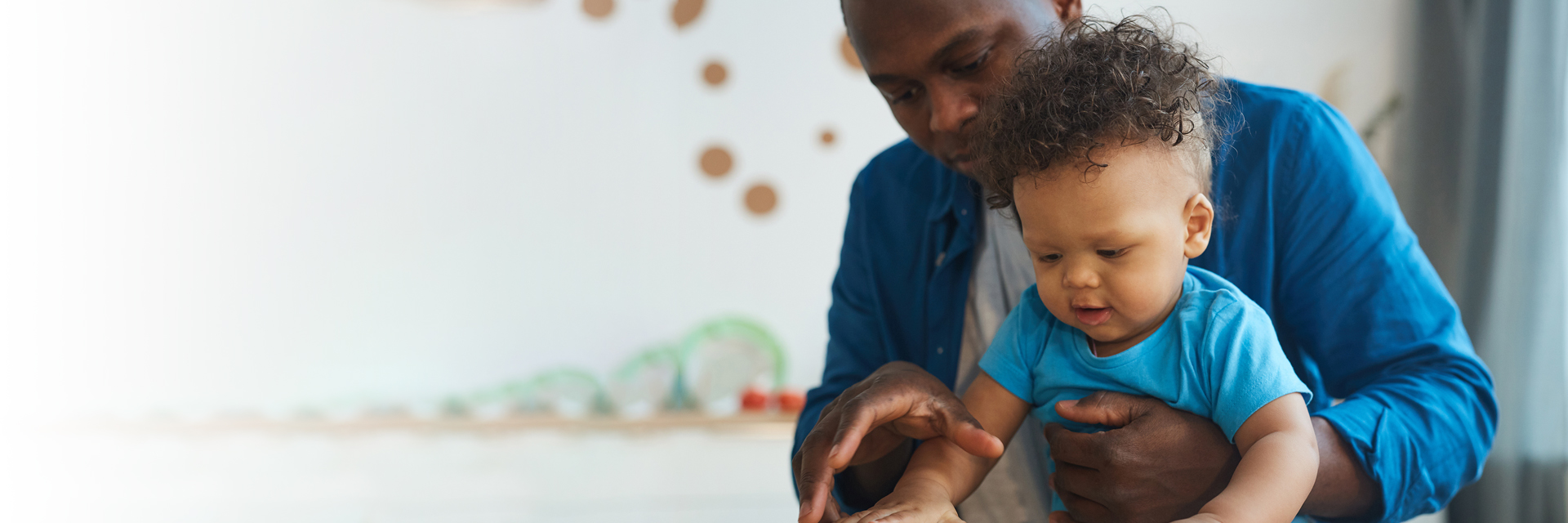 Dad holding baby boy