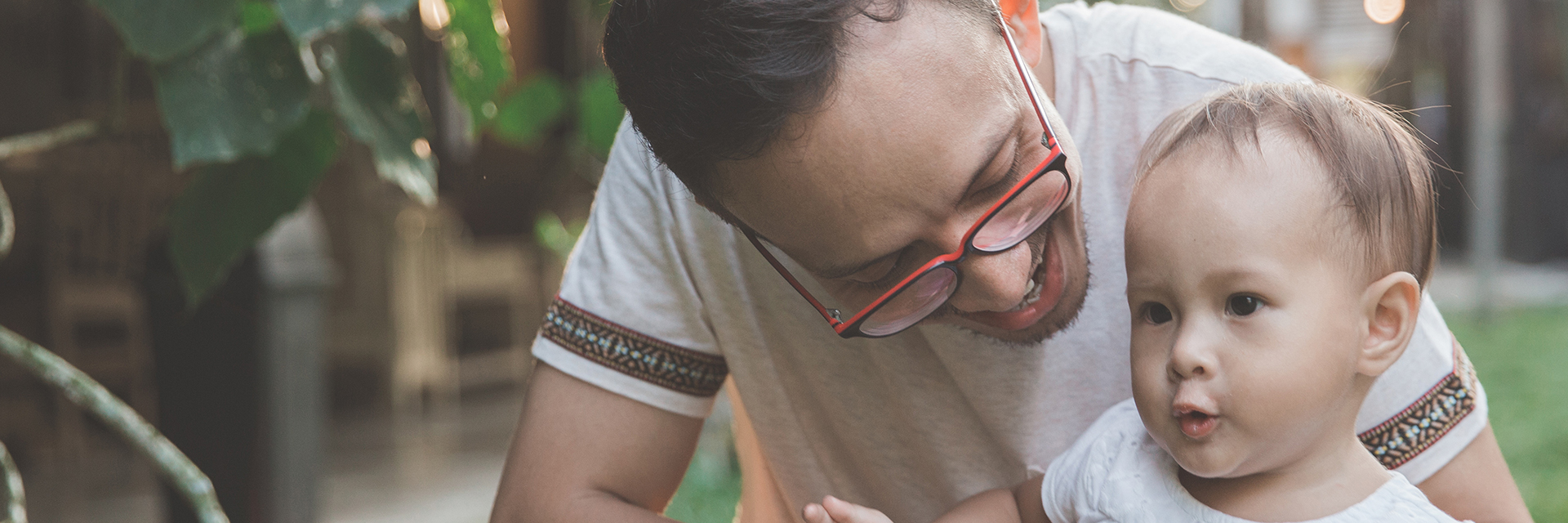 Dad and baby playing outside