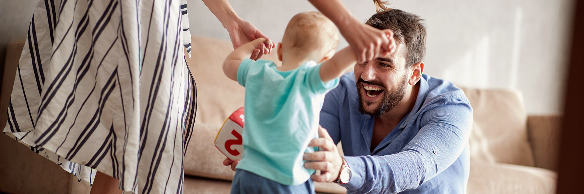 Parents playing with little boy