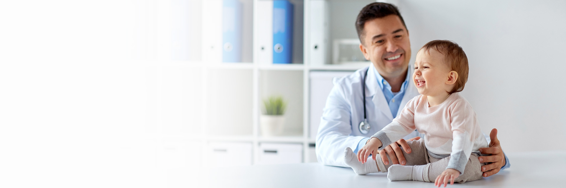 Doctor and smiling baby