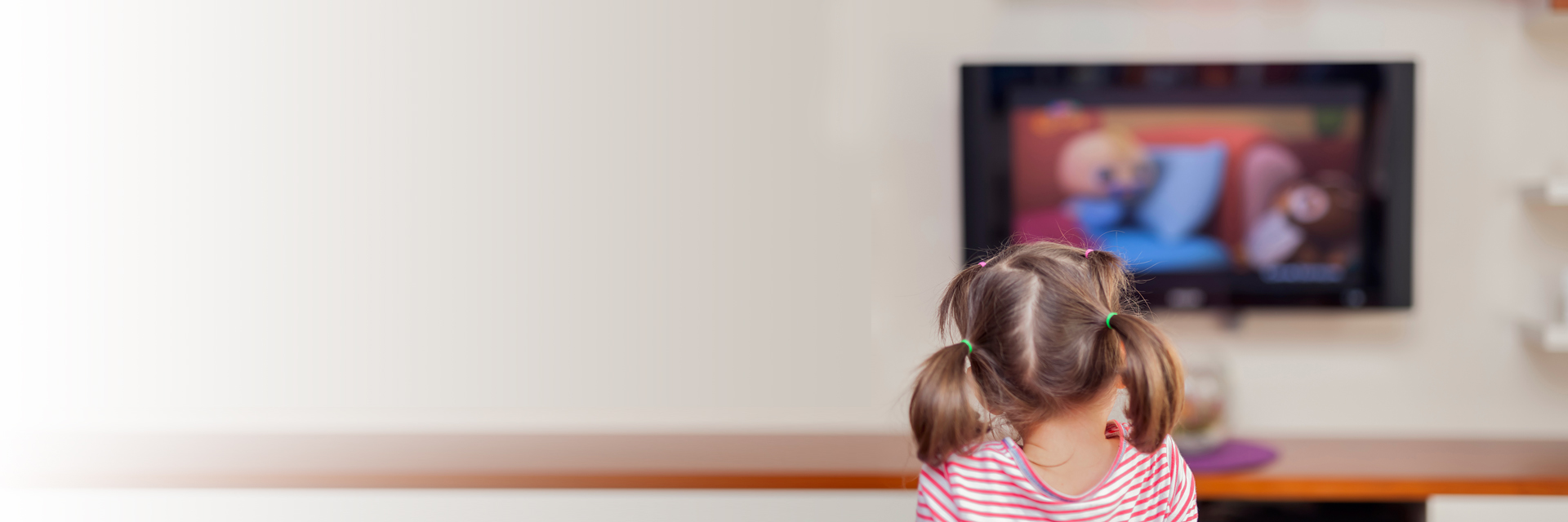 Little girl watching tv
