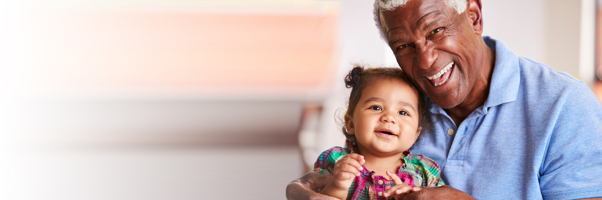 Baby with laughing grandpa