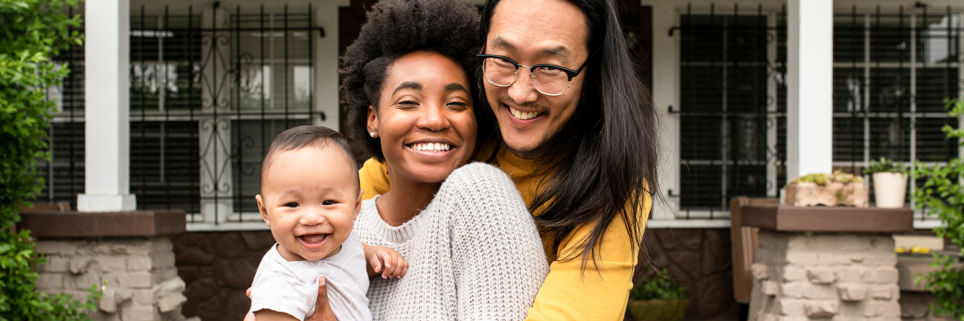 Mom and dad outside with baby