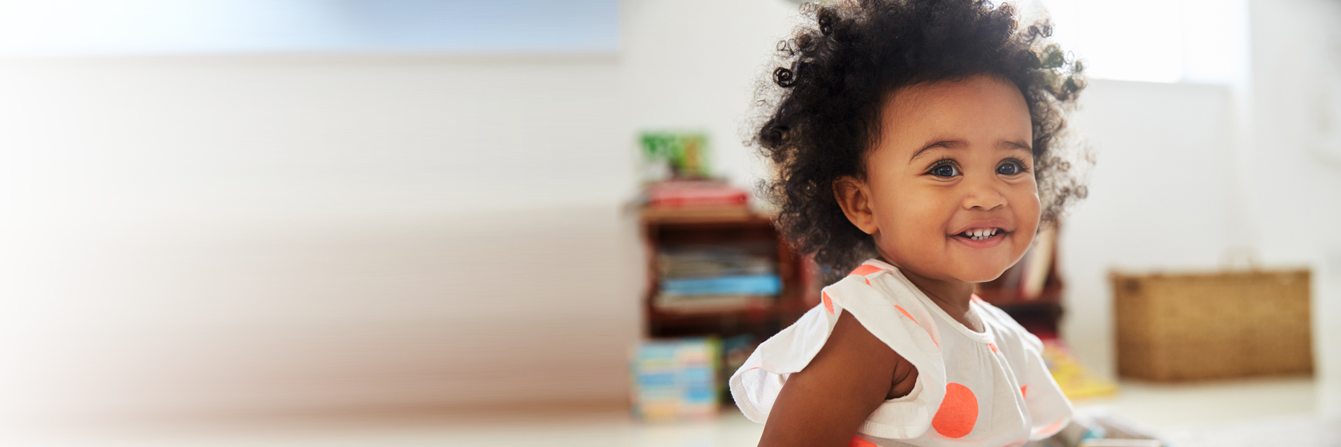 Little girl sitting and smiling