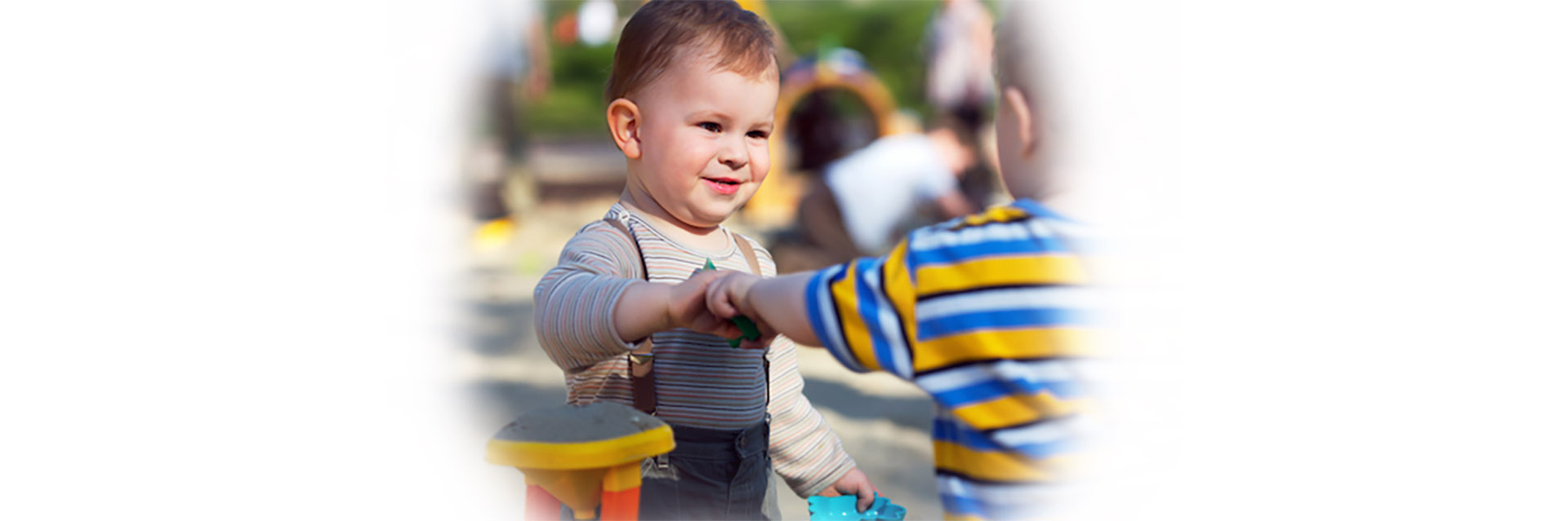 Toddler boys playing outoors