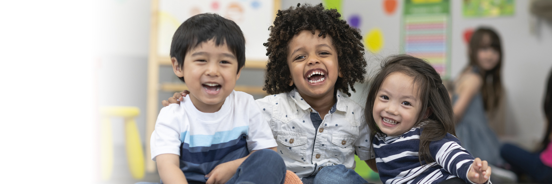 Kids in classroom hugging