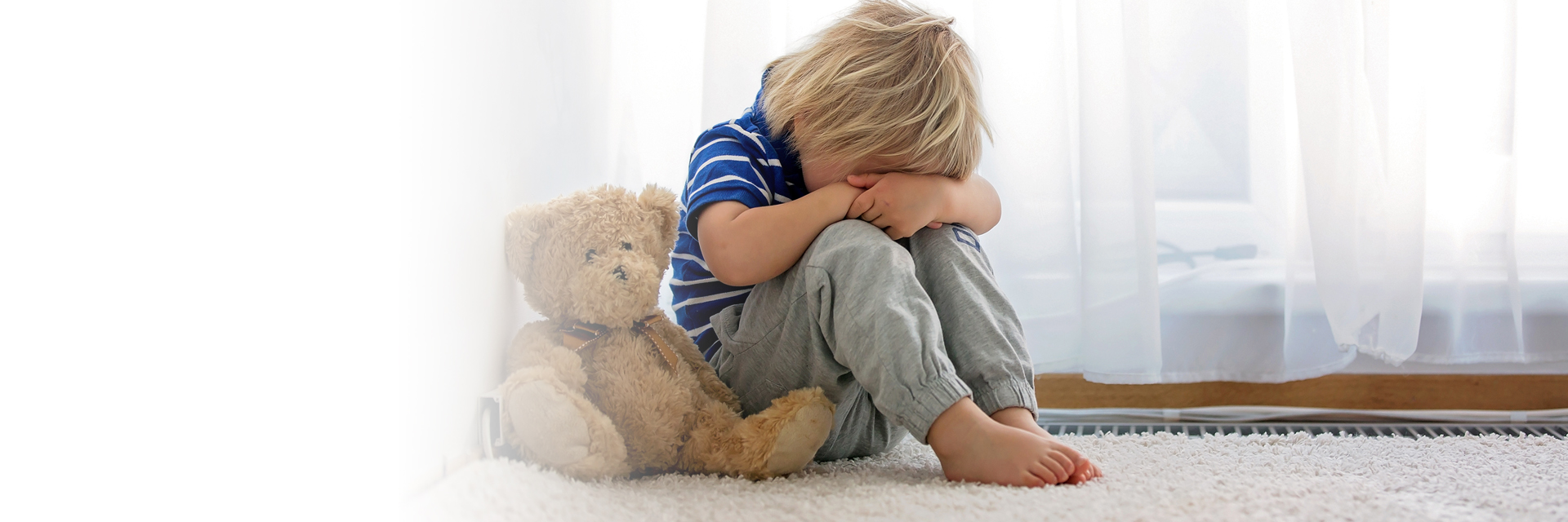 Little boy looking down