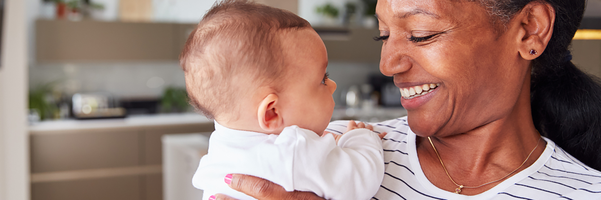 Mature mom holding baby