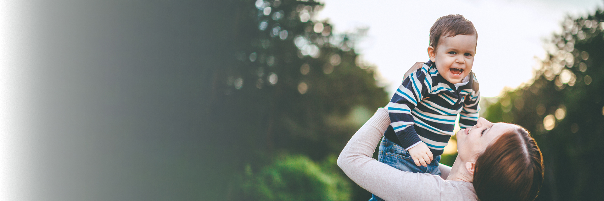 Mom playing with child outside