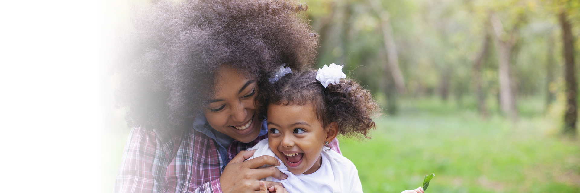 Mom playing with daughter outside