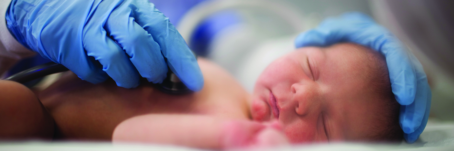 Newborn baby getting exam