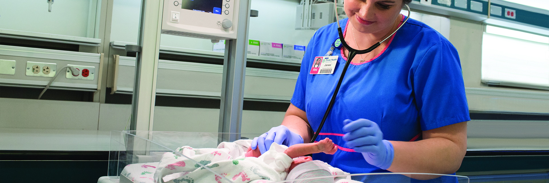 Nurse with newborn in hospital
