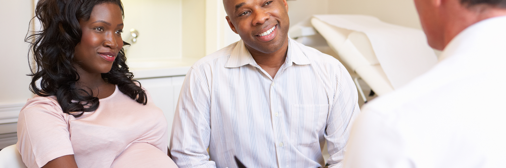 Couple talking to provider exam 