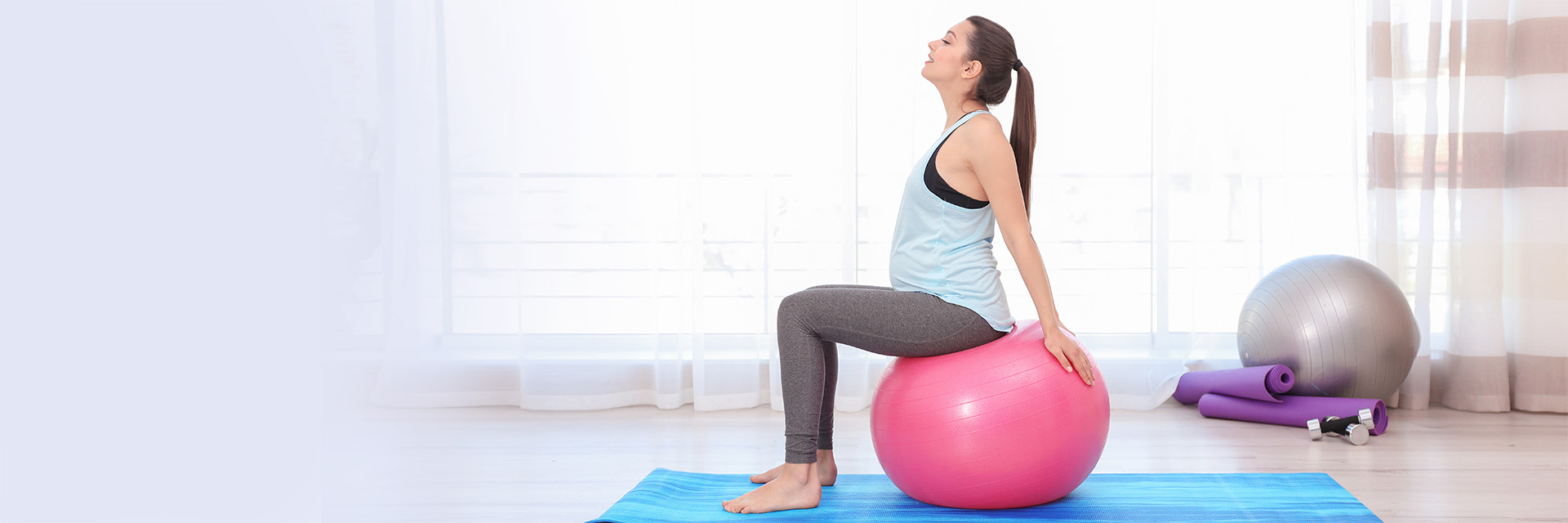 Woman balancing on yoga ball