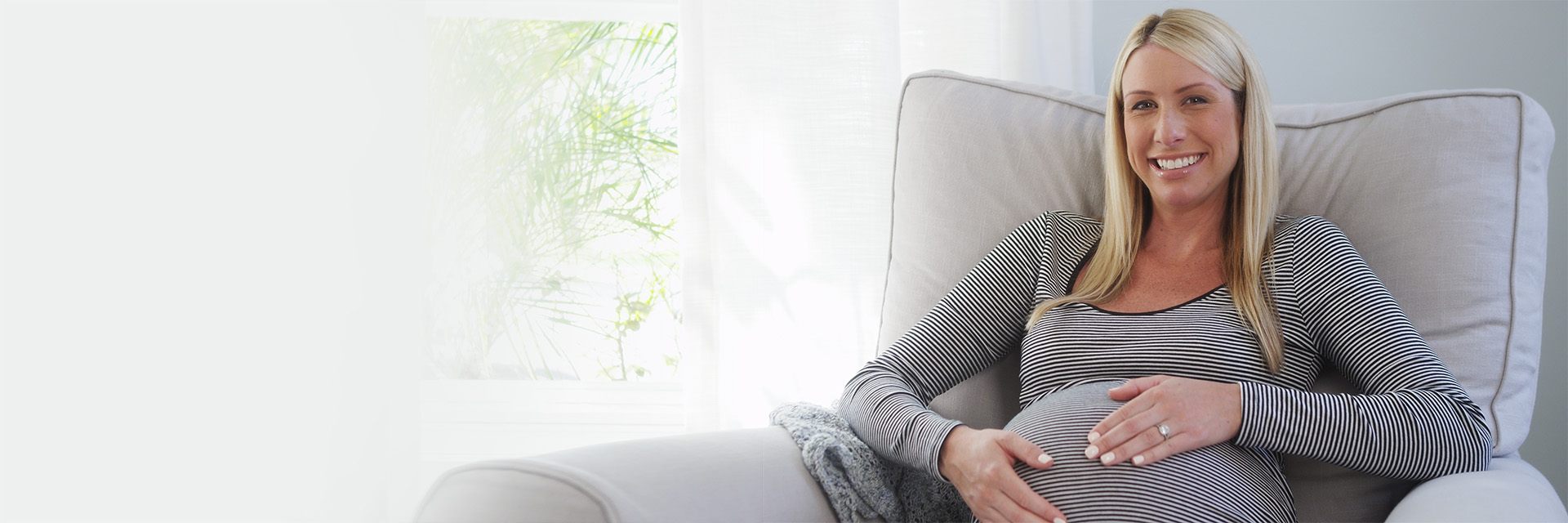 Woman smiling in large chair