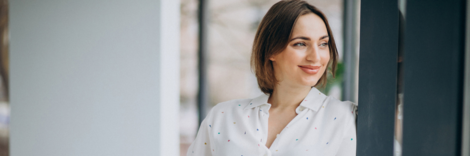 Woman looking out the window and smiling