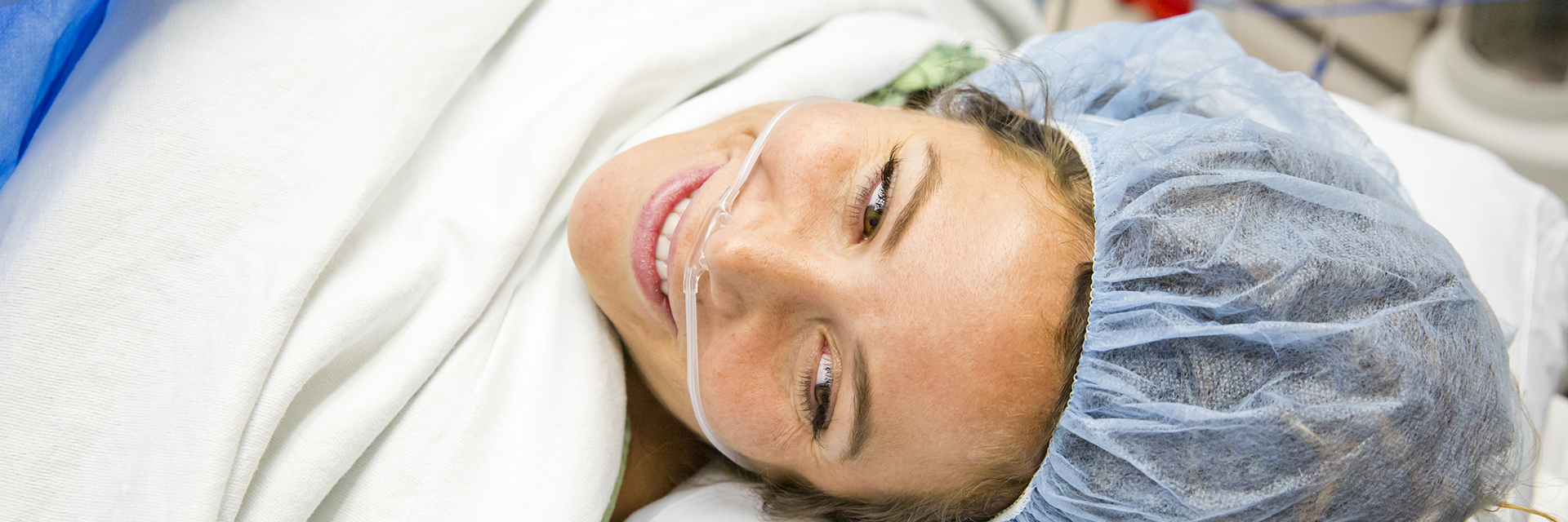 Woman in surgical cap smiling