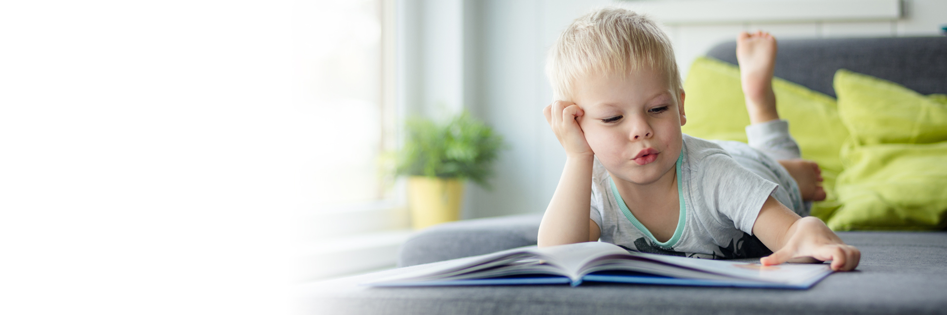 Toddler on stomach reading