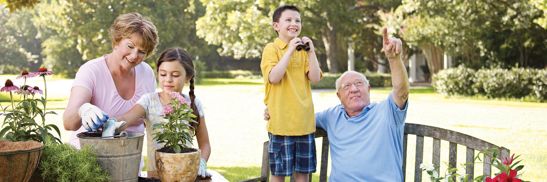 Grandparents gardening with grandchildren