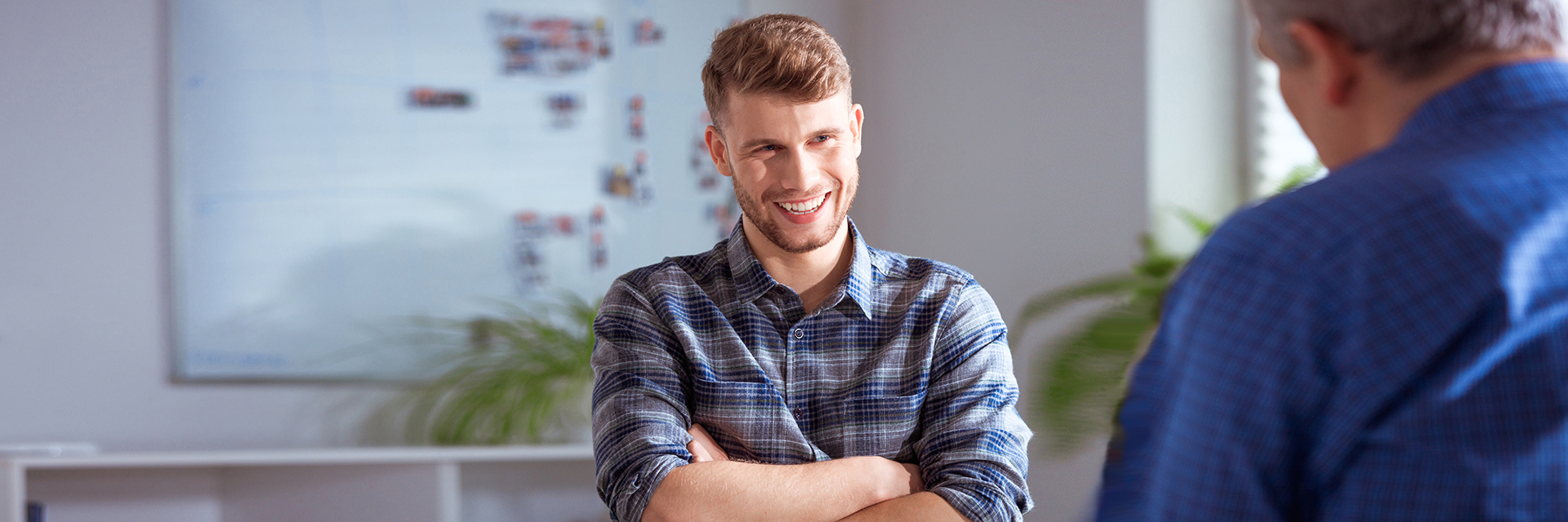 Smiling man talking to therapist