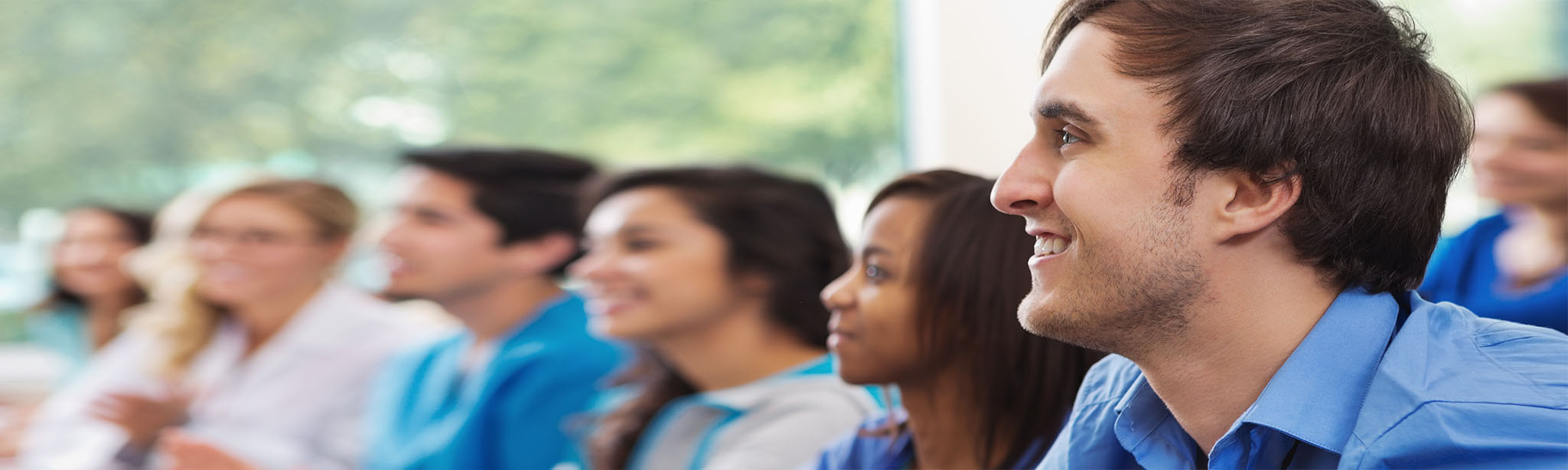 Diverse group of people in medical workshop class
