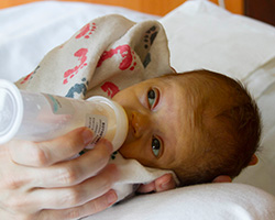 Baby with milk bottle