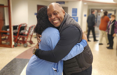 Yon King hugging Nurse Sheona
