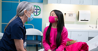 Child in clinic with provider