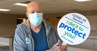 Man with vaccine sign