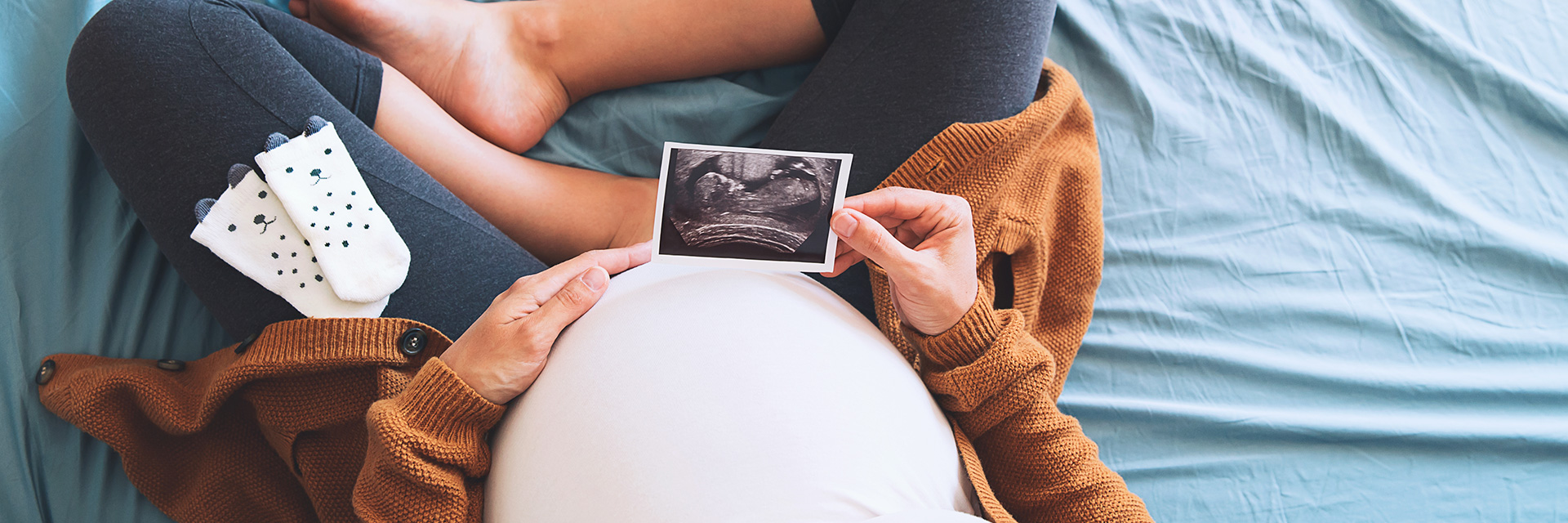 Pregnant Women Looking at Ultrasound Photo