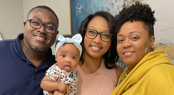 Adrian (left) and Ashley Burnett with daughter Scarlett and OBGYN Quanita Crable, M.D.