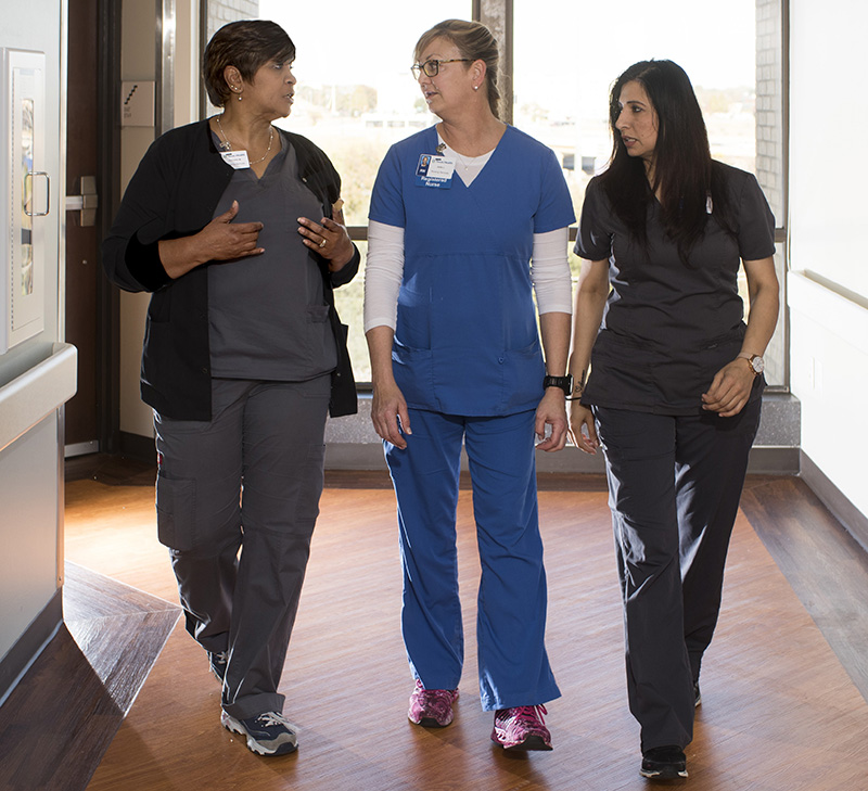 Providers walking in hallway