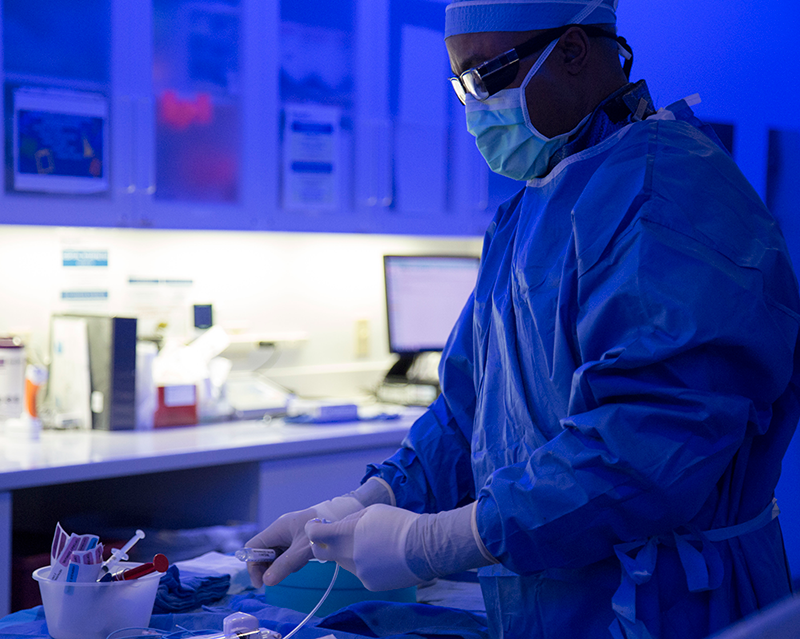 Surgeon at prep table