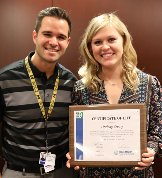 Aaron Gonzalez, EMS program manager, and grateful patient Lindsay Casey.