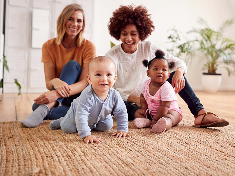 Two women with babies