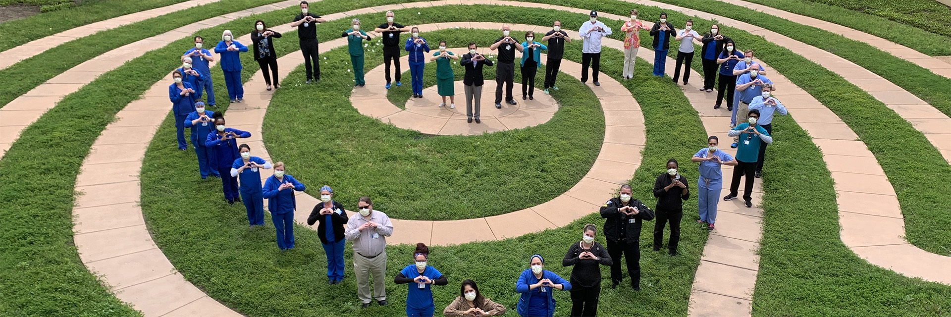 Texas Health Alliance Staff Forming Heart in the Garden