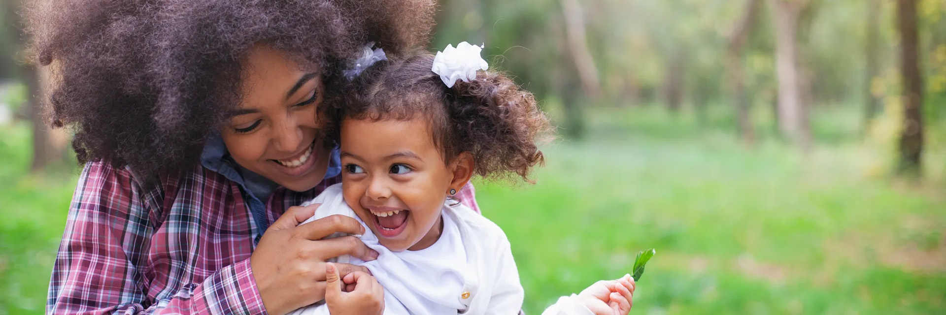 Mother and daughter playing outside